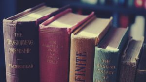 Aesthetic collection of vintage books showcasing classic literature with textured covers.